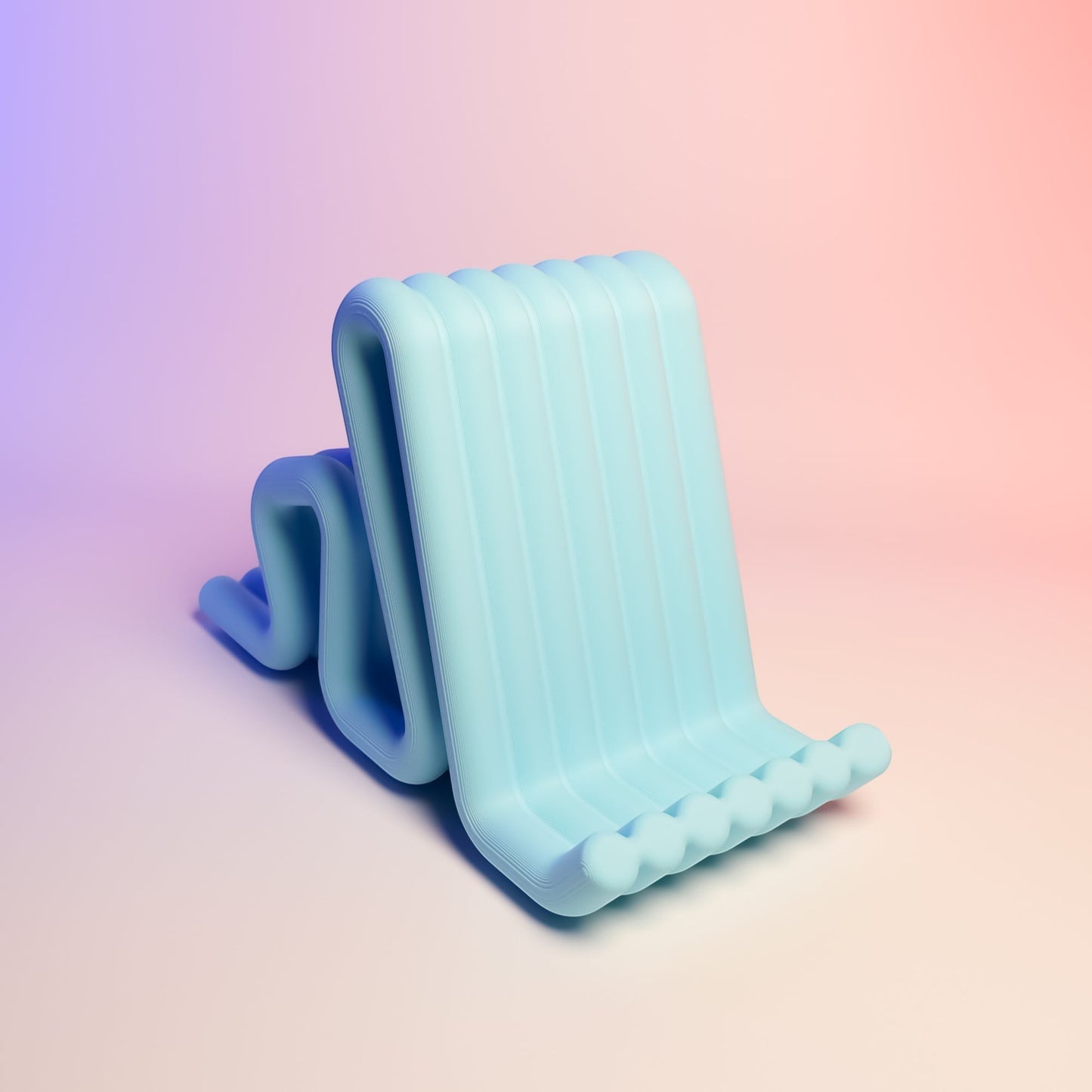 MJR Crafted light blue wavy phone stand made of flexible material, perfect for desks.