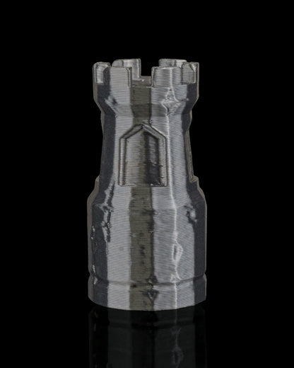 MJR Crafted dark grey 3D printed chess rook piece with crenellated top and castle detail.