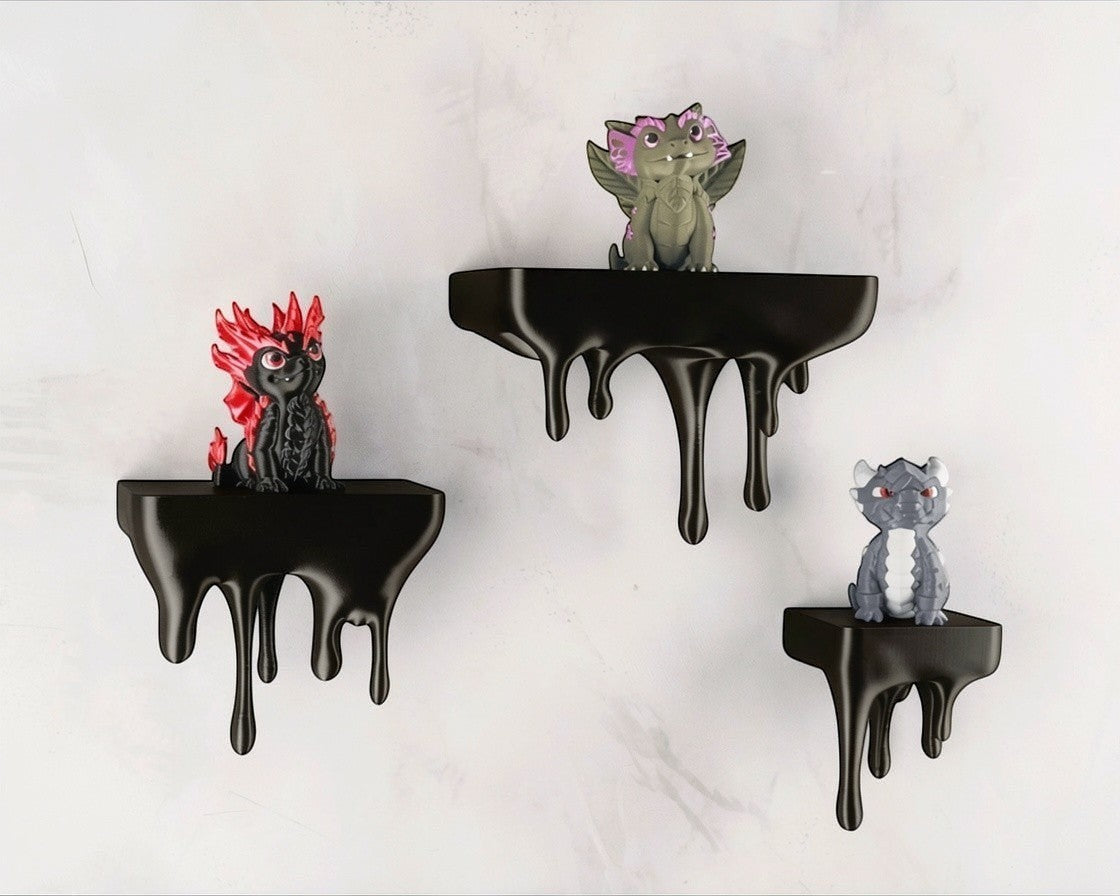 MJR Crafted blue 3D printed melting shelf with a dripping effect, holding dragon figurines. Unique wall mount.