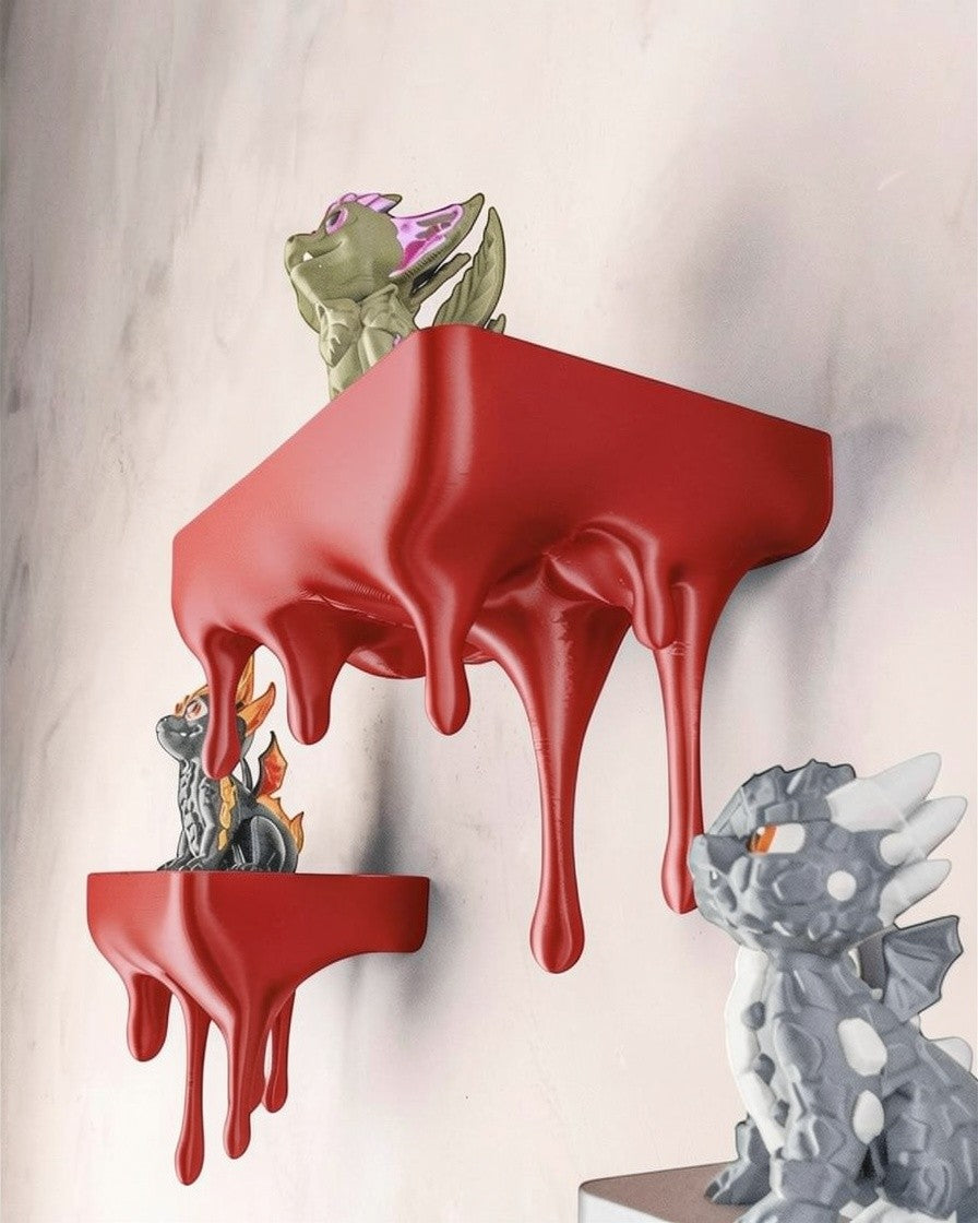 MJR Crafted blue 3D printed melting shelf with dripping effect, holding dragon figurines.