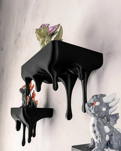 MJR Crafted blue 3D printed melting shelf with a unique dripping design, holding dragon figurines.