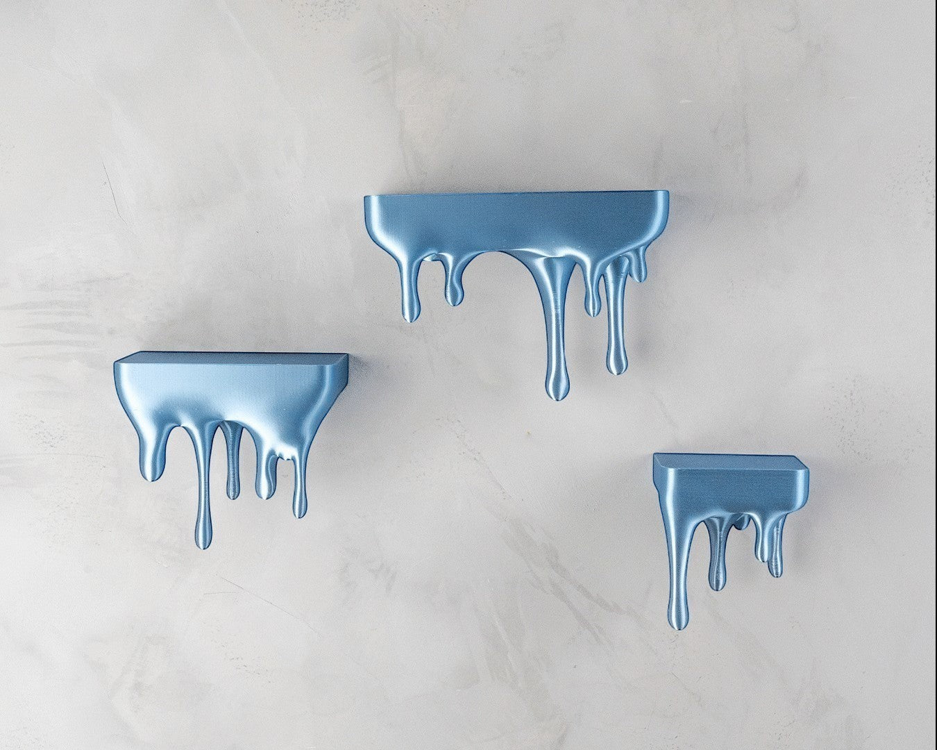 MJR Crafted blue 3D printed melting shelf with a dripping effect, mounted on a textured wall.
