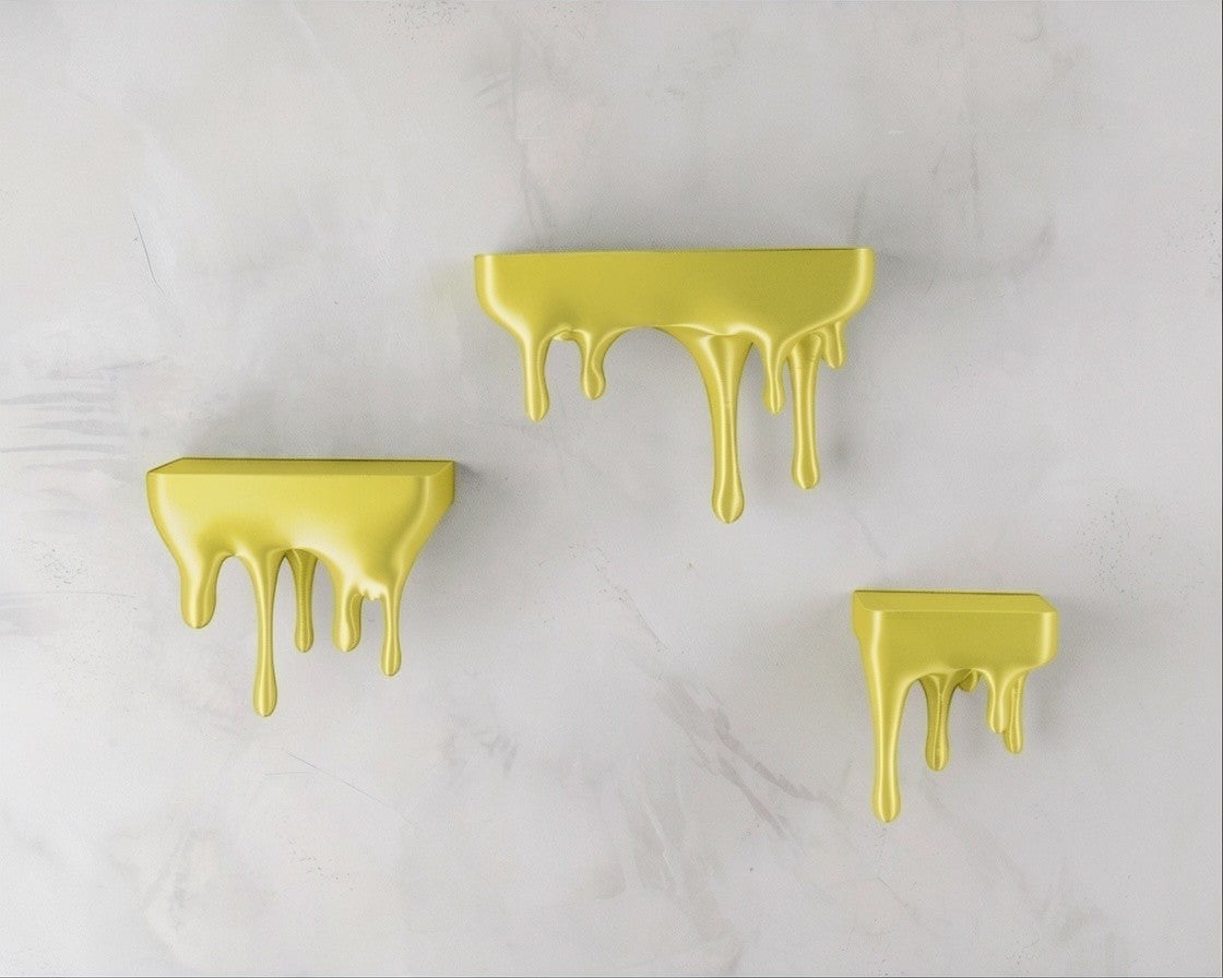 MJR Crafted blue 3D printed melting shelves with a metallic sheen, mounted on a textured wall.