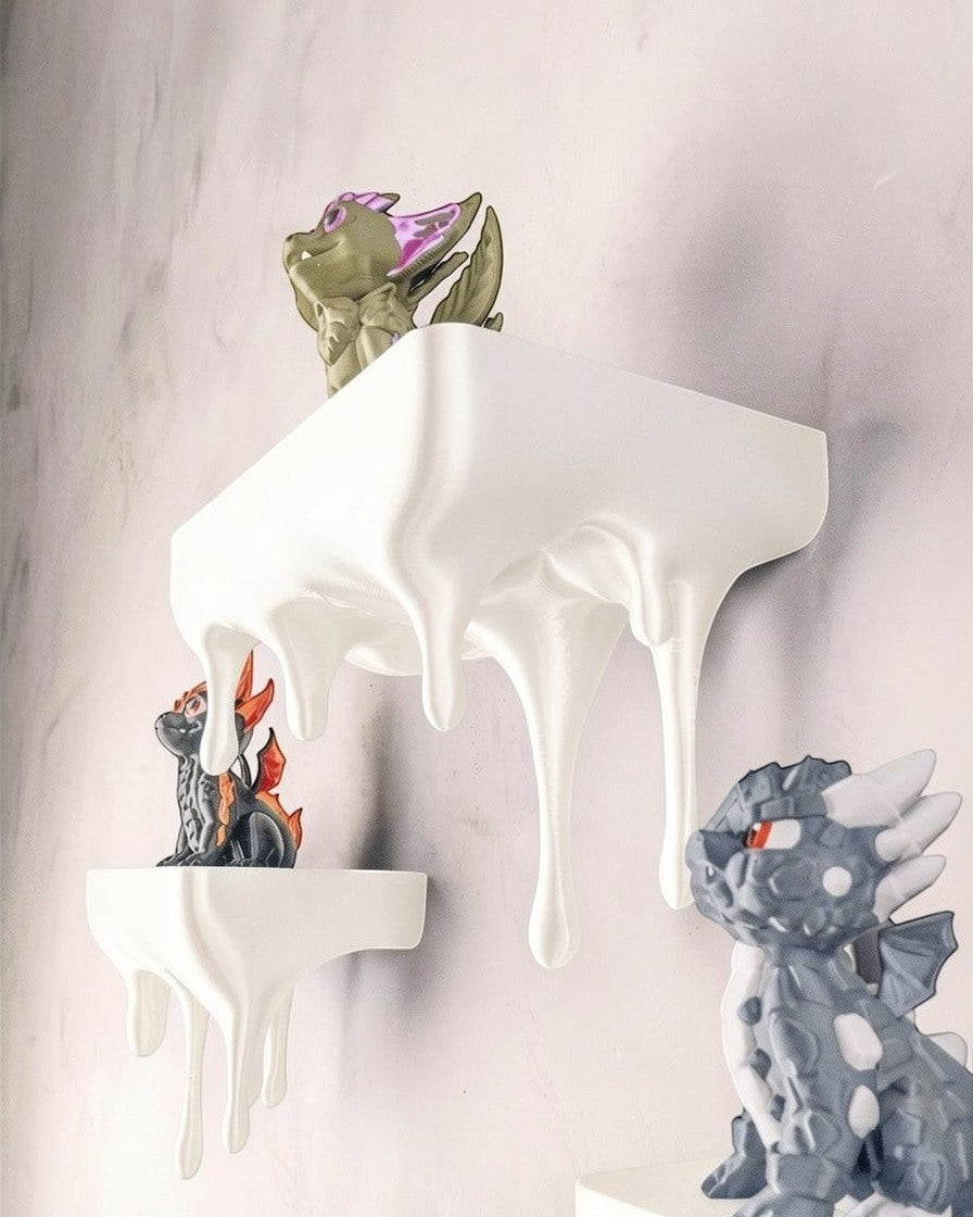 MJR Crafted blue 3D printed melting shelf with a unique hand-holding design, displaying dragon figurines.