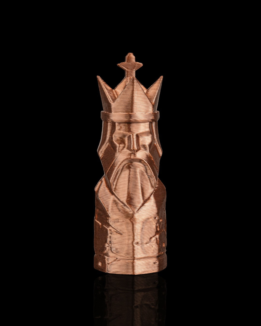 MJR Crafted copper-colored 3D printed king chess piece with crown and beard detail on black background.