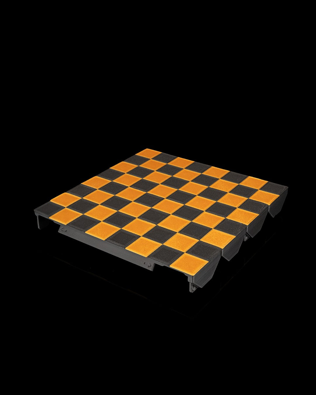 MJR Crafted orange and black 3D printed fold-up checkers board with integrated storage.