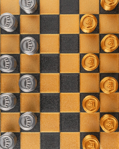 MJR Crafted fold-up checkers set with gold and silver 3D printed pieces on a black and gold board.