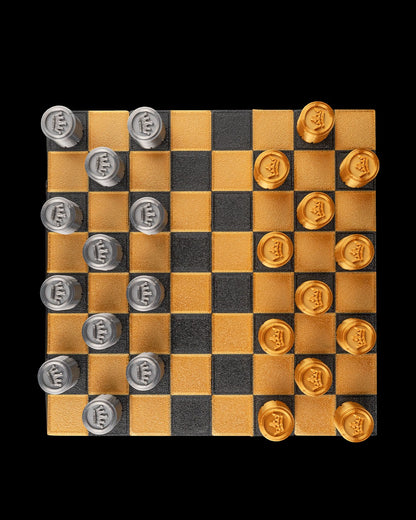 MJR Crafted fold-up checkers set with gold and silver pieces on a black and gold board. 3D printed for durability.