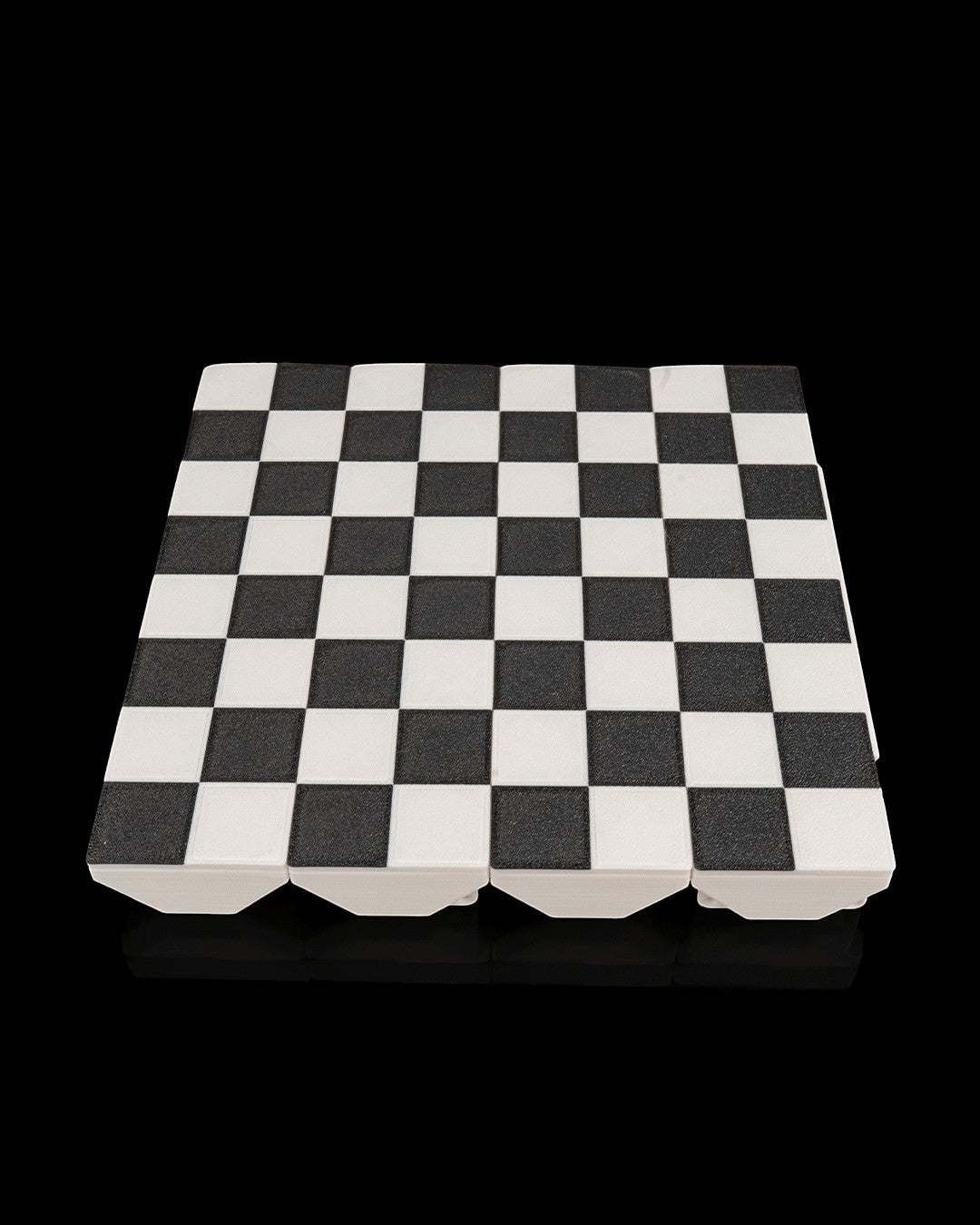 MJR Crafted black and white 3D printed fold-up chess board with integrated storage. Durable and portable.