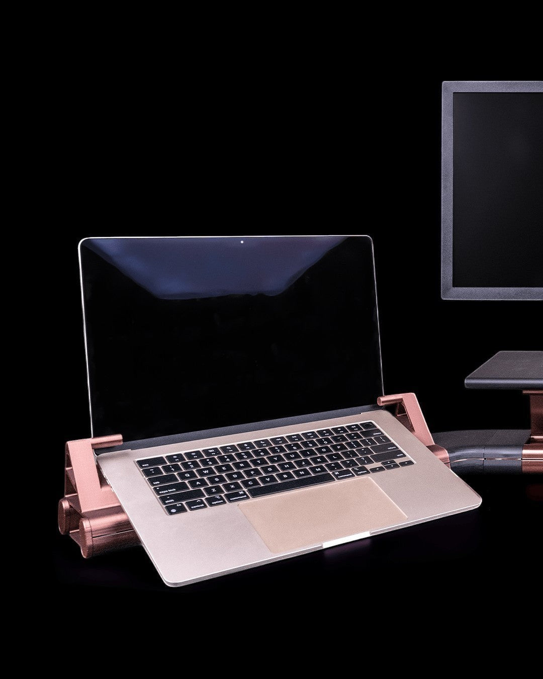 MJR Crafted Focus Desk Hub with gray and bronze modular laptop stand and monitor riser on a black background.