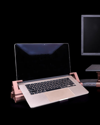 MJR Crafted Focus Desk Hub with gray and bronze modular laptop stand and monitor riser on a black background.