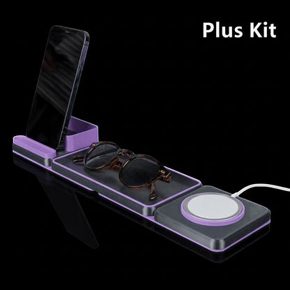 MJR Crafted modular desk organizer system in purple and black, holding a phone, sunglasses, and a wireless charger.