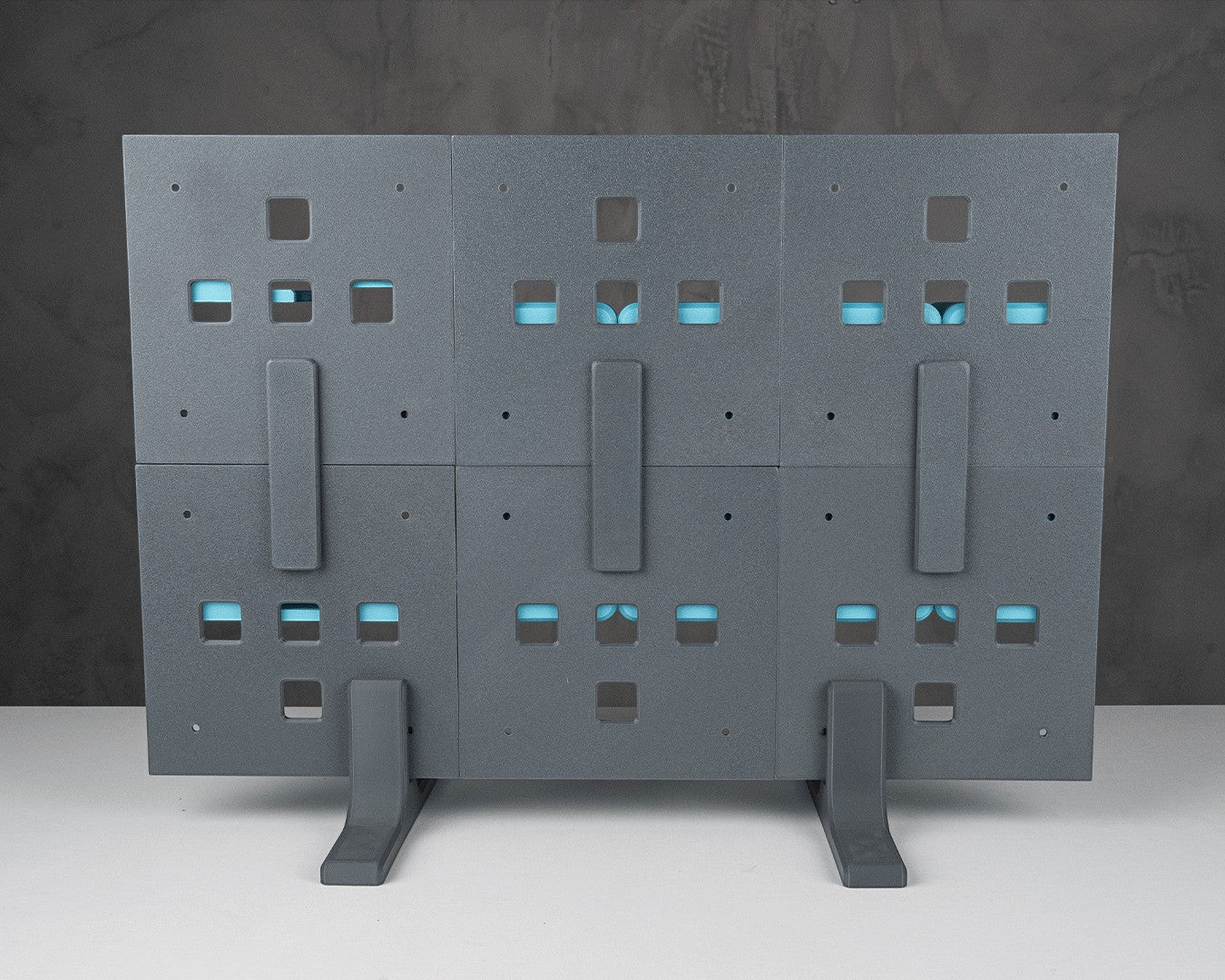 MJR Crafted modular organizer system in dark grey with blue accents, featuring a configurable design for desks and walls.