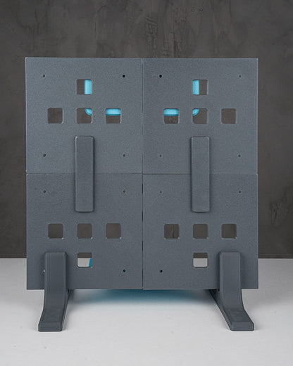 MJR Crafted modular organizer system in grey with blue accents, featuring square cutouts and supporting feet.