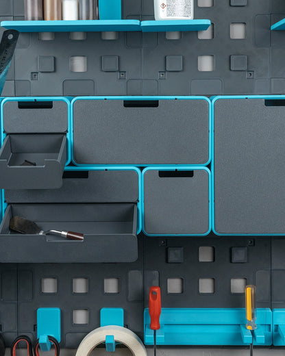 MJR Crafted modular organizer system in grey and teal, featuring drawers, shelves, and tool holders for a workspace.