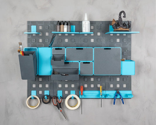 MJR Crafted modular organizer system in grey and teal, featuring shelves, drawers, and tool holders with craft supplies.