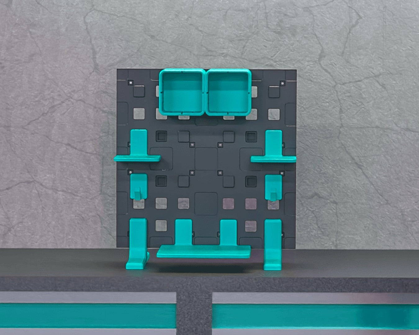 MJR Crafted modular organizer system in dark grey with teal shelves, drawers, and hooks. Versatile for walls or desks.