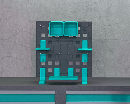 MJR Crafted modular organizer system in dark grey with teal shelves, drawers, and hooks. Versatile for walls or desks.