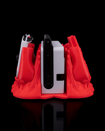 MJR Crafted red 3D printed dock cover and controller holder for Nintendo Switch, featuring a monster design.