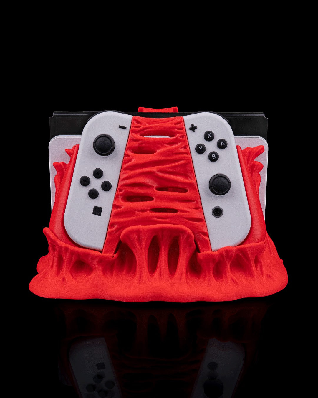 MJR Crafted red 3D printed dock cover and controller holder for Nintendo Switch, featuring a monster design.
