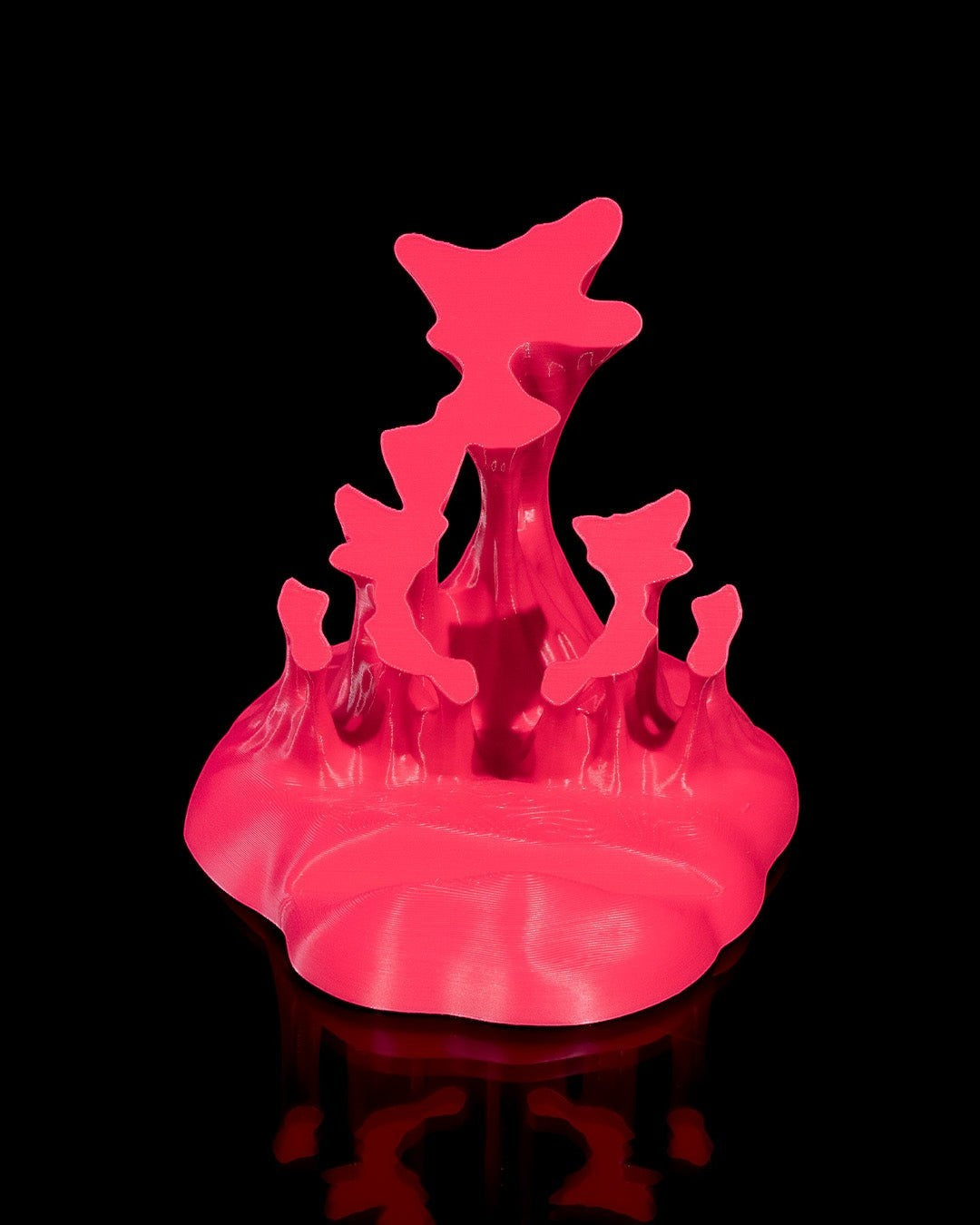 MJR Crafted pink 3D printed phone stand with sculptural wave design and textured finish.