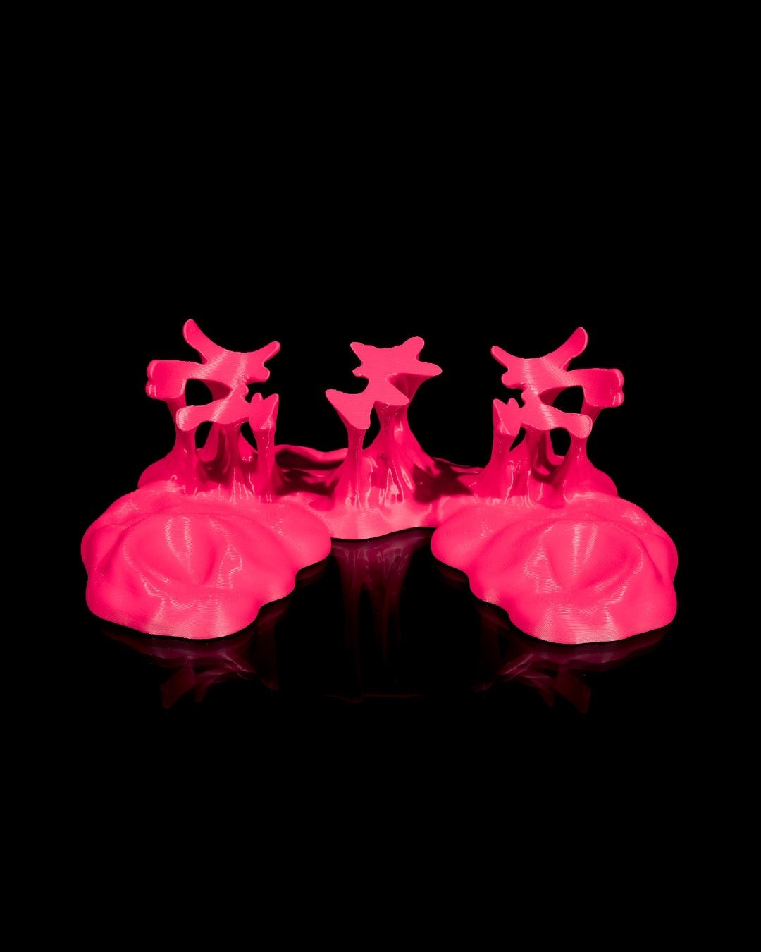 MJR Crafted pink 3D printed controller stand for PS5 and Xbox controllers, minimalist design.