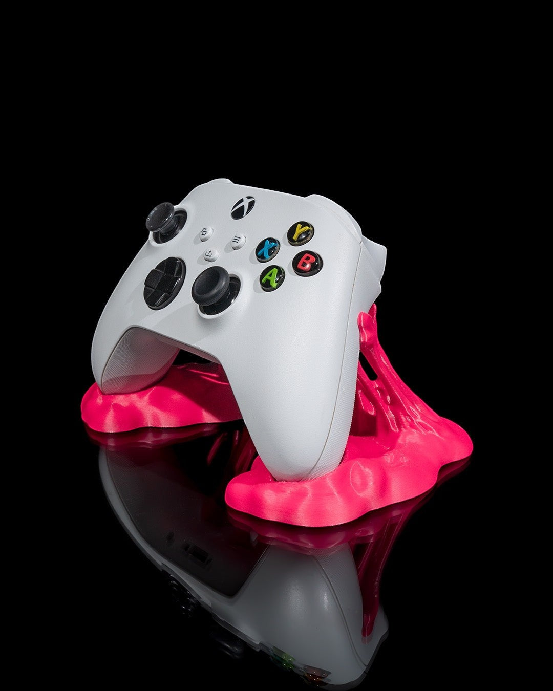 MJR Crafted pink controller stand holding a white Xbox controller, perfect for gaming organization.