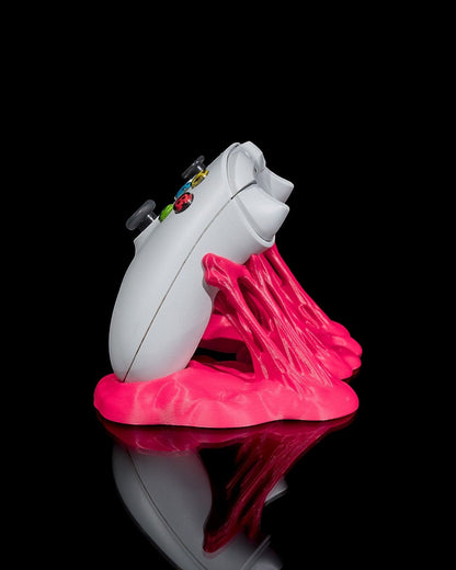 MJR Crafted pink abstract controller stand holding a white Xbox controller, perfect for gaming organization.