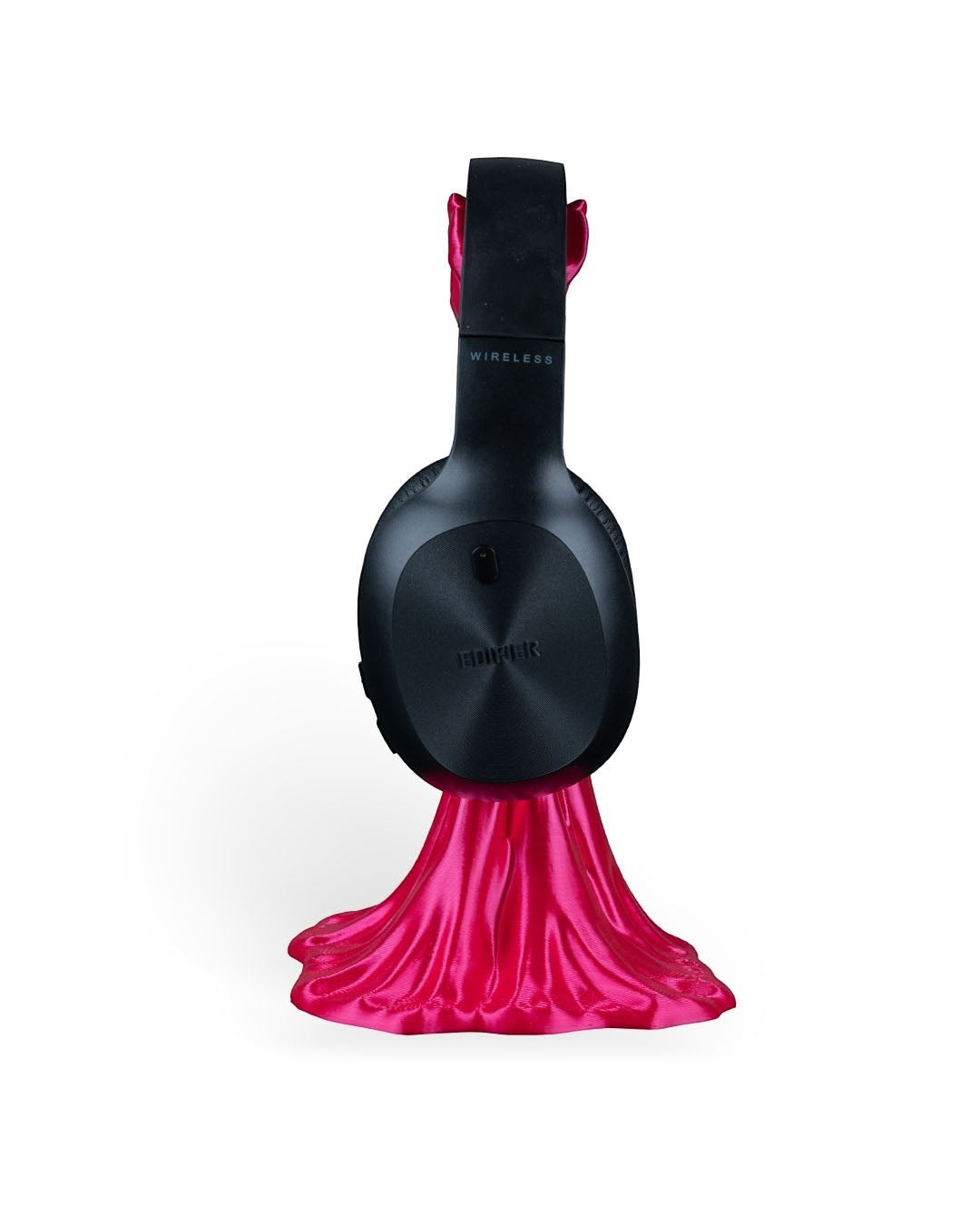 MJR Crafted pink drumstick headphone stand holding black wireless headphones.