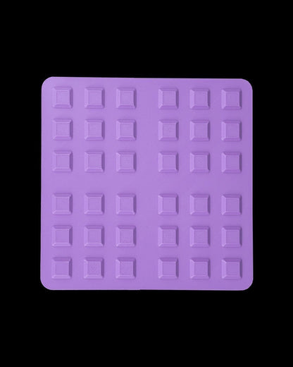 MJR Crafted purple modular desk organizer system base with a grid of square indentations for customization.