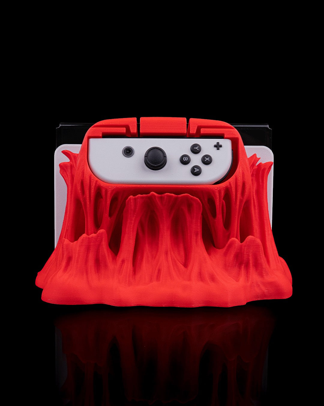 MJR Crafted red 3D printed "Chew It" monster dock cover and controller holder for Nintendo Switch/OLED.