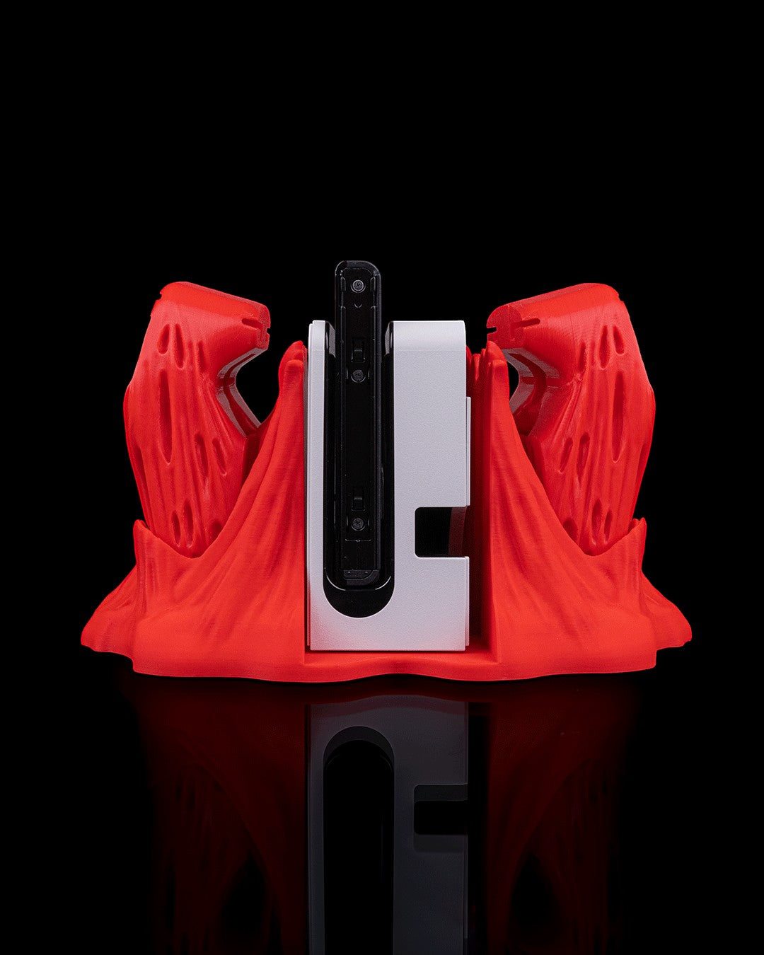 MJR Crafted red 3D printed "Chew It" monster dock cover and controller holder for Nintendo Switch.