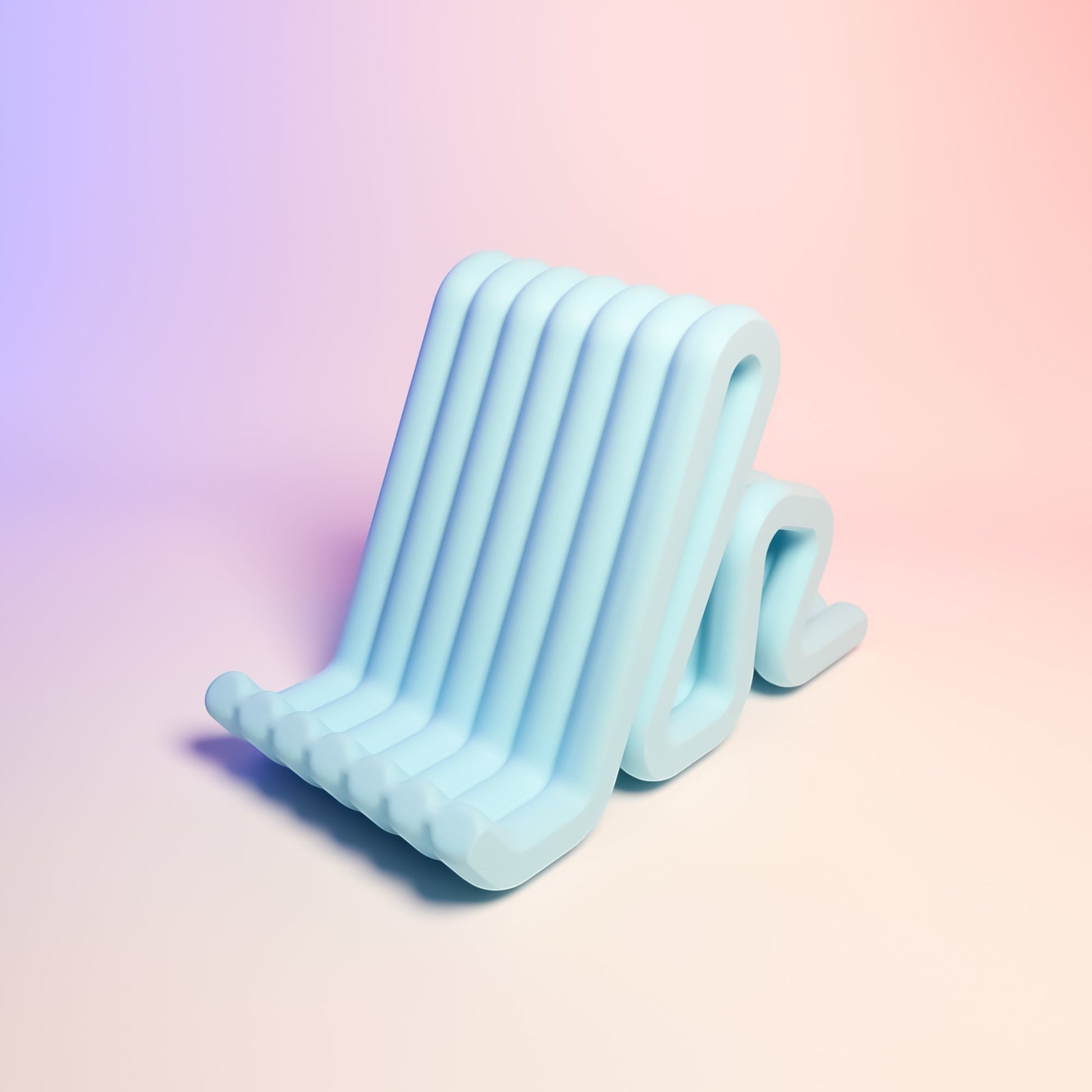 MJR Crafted light blue wavy phone stand made of flexible material, perfect for desks and nightstands.