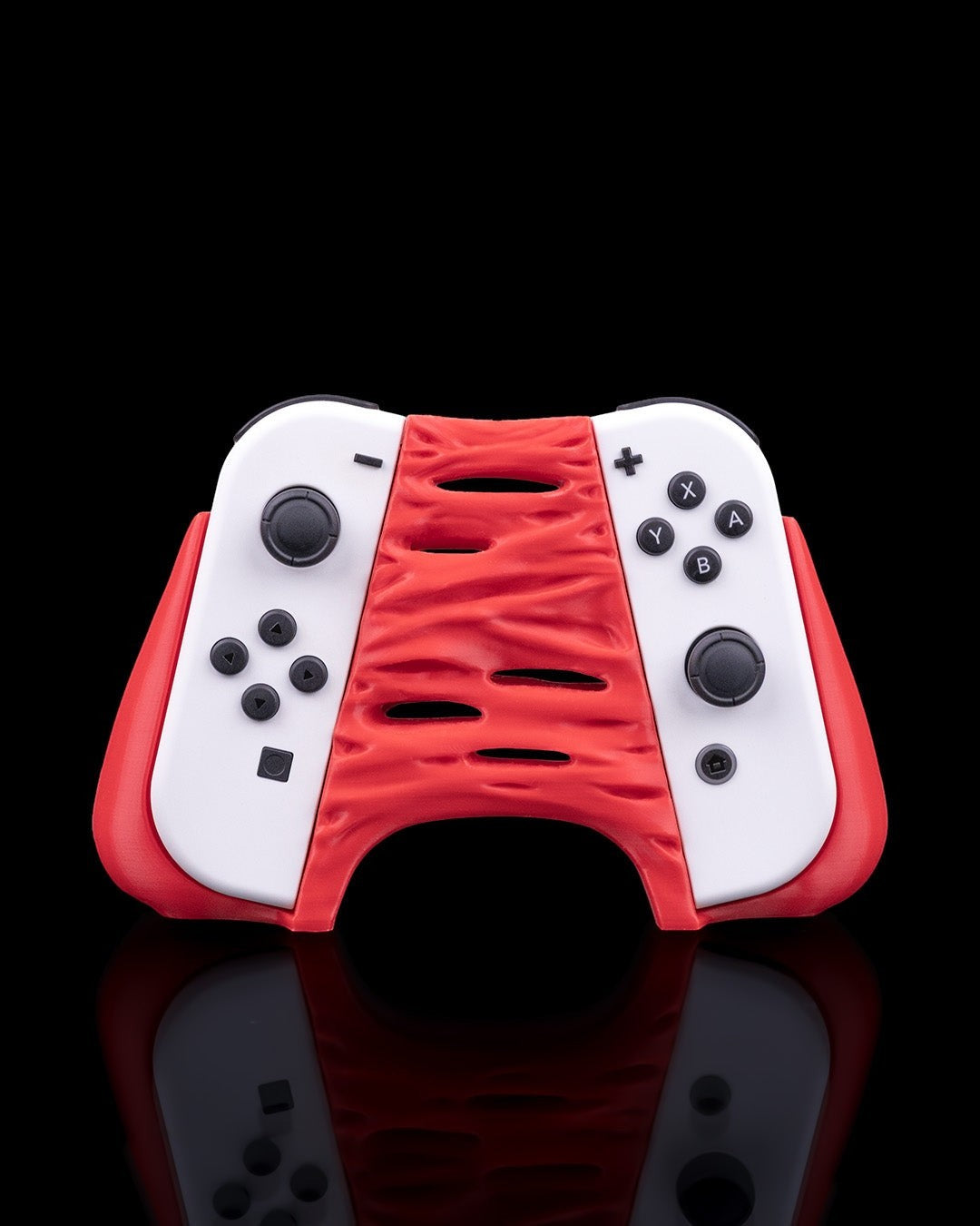 MJR Crafted red and white "Chew It" monster 3D-printed controller holder for Nintendo Switch.