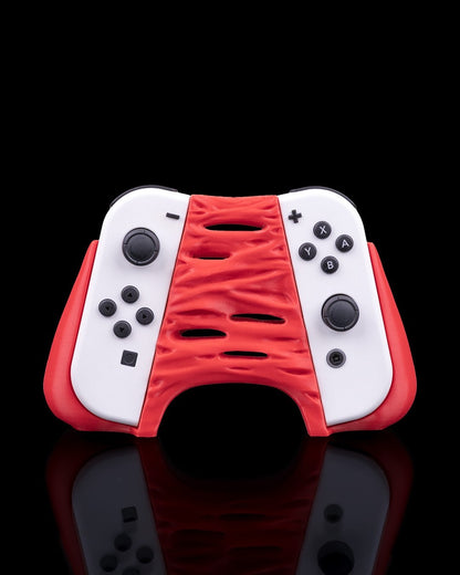 MJR Crafted red and white "Chew It" monster 3D-printed controller holder for Nintendo Switch.