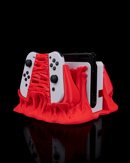 MJR Crafted red monster 3D-printed dock cover and controller holder for Nintendo Switch/OLED.